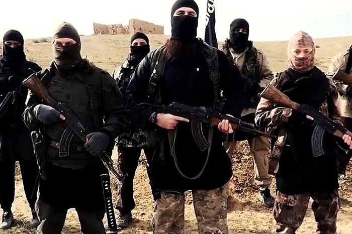 Isis has banned these logos, so Iraqi militants are going to wear them in battle